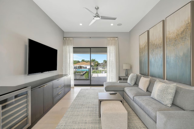 living room featuring light wood-style floors, wine cooler, ceiling fan, and recessed lighting