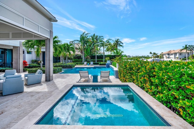 pool with a patio area