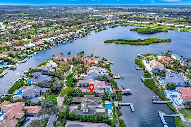 bird's eye view with a residential view and a water view