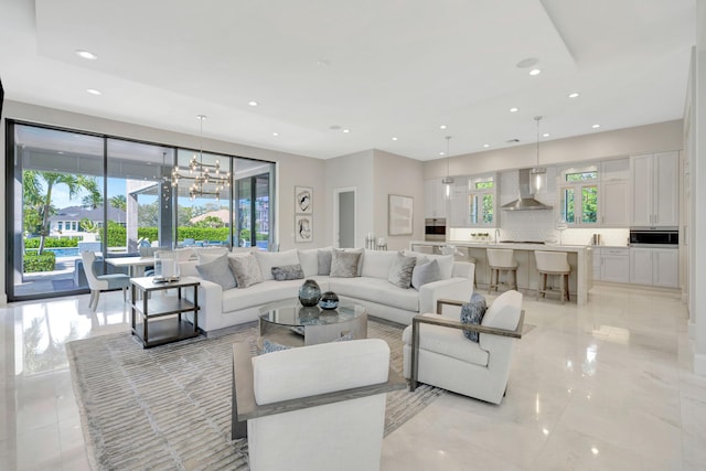 living area with an inviting chandelier and recessed lighting