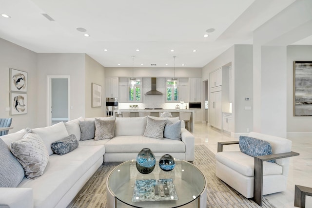 living room with baseboards and recessed lighting