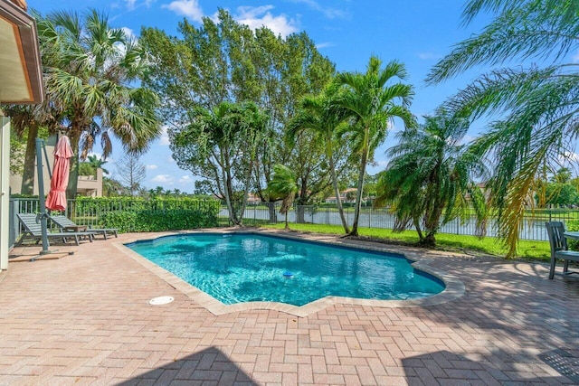 view of swimming pool with a fenced in pool, a patio, and fence