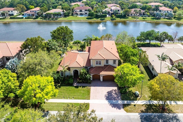 aerial view featuring a water view and a residential view