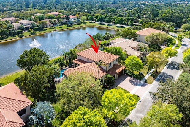 birds eye view of property with a water view and a residential view