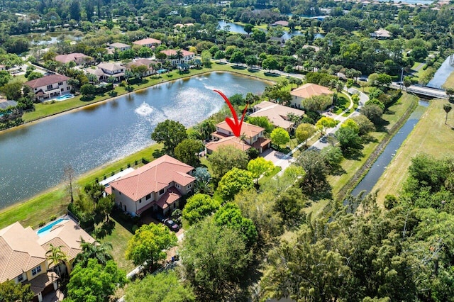 aerial view with a residential view and a water view