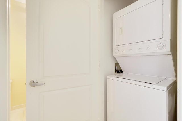 laundry room with laundry area and stacked washing maching and dryer