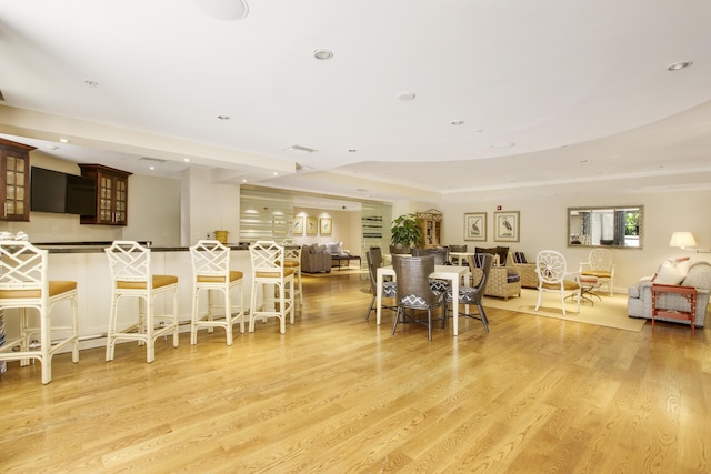 dining area with recessed lighting and light wood-style floors