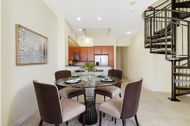 dining space with light tile patterned floors, baseboards, stairway, and recessed lighting