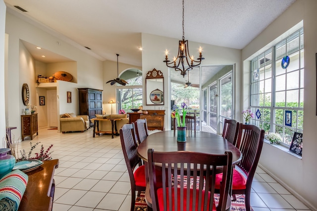6861 Briarlake Cir, Palm Beach Gardens, FL 33418 - dining room featuring lofted ceiling, healthy amount of natural light, ceiling fan, light tile patterned floors, and a chandelier