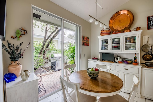 dining space featuring light tile patterned floors