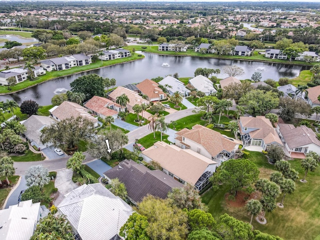 birds eye view of property with a residential view and a water view