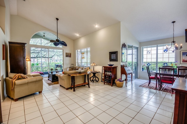 6861 Briarlake Cir, Palm Beach Gardens, FL 33418 - living room featuring a chandelier, plenty of natural light, high vaulted ceiling, and light tile patterned flooring