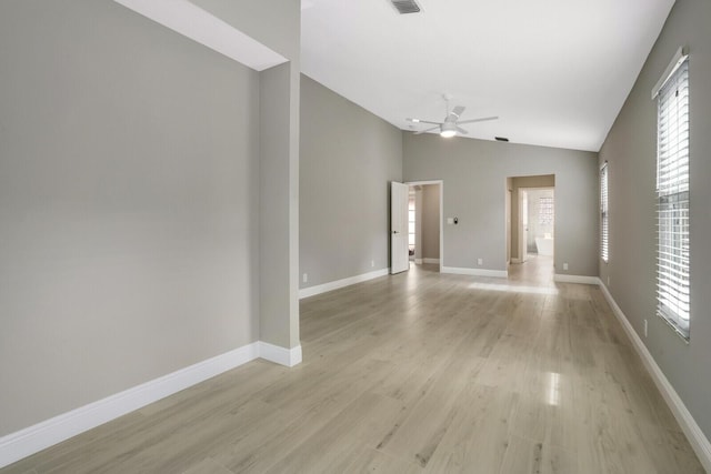 unfurnished living room with lofted ceiling, visible vents, ceiling fan, light wood-type flooring, and baseboards