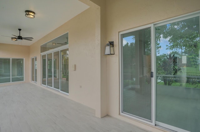 exterior space featuring ceiling fan