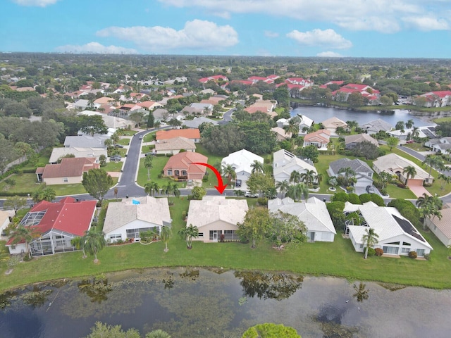 bird's eye view featuring a water view and a residential view