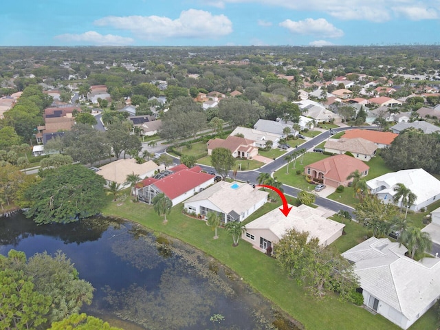 birds eye view of property with a residential view and a water view