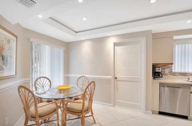 dining room with a tray ceiling, visible vents, recessed lighting, and light tile patterned flooring