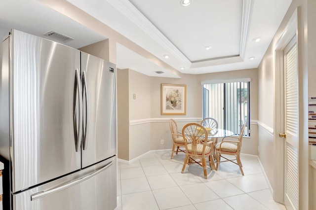 dining room featuring light tile patterned floors, a tray ceiling, visible vents, and recessed lighting