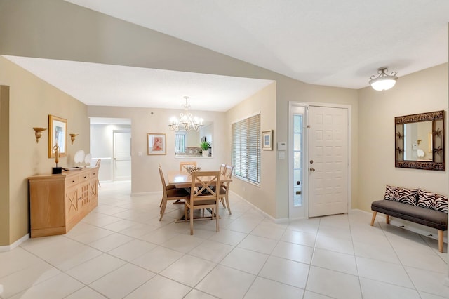 dining space with light tile patterned floors, an inviting chandelier, and baseboards