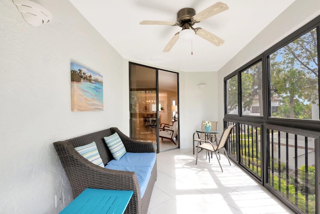 sunroom with a ceiling fan