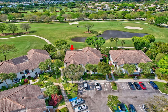 aerial view featuring view of golf course and a residential view