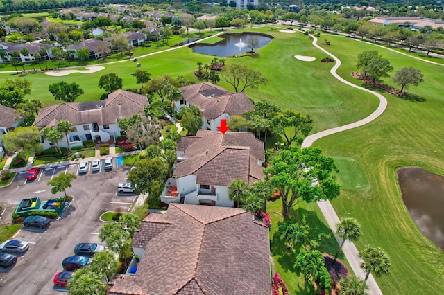 birds eye view of property with a residential view, view of golf course, and a water view