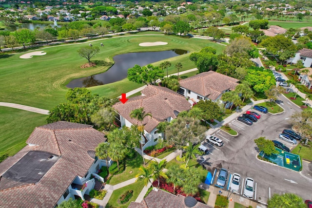 aerial view with a water view, a residential view, and golf course view