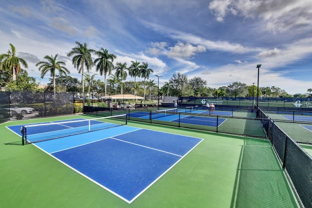 view of tennis court with fence