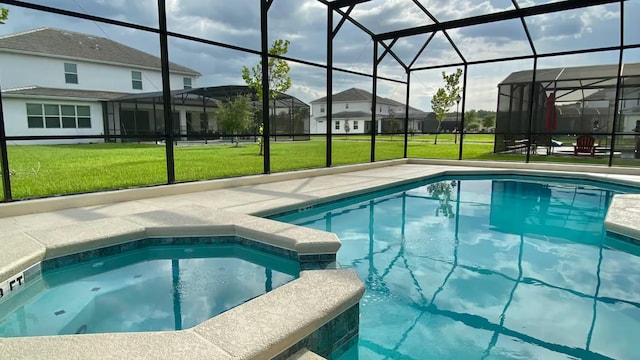 view of pool featuring glass enclosure, a patio, a pool with connected hot tub, a lawn, and a residential view