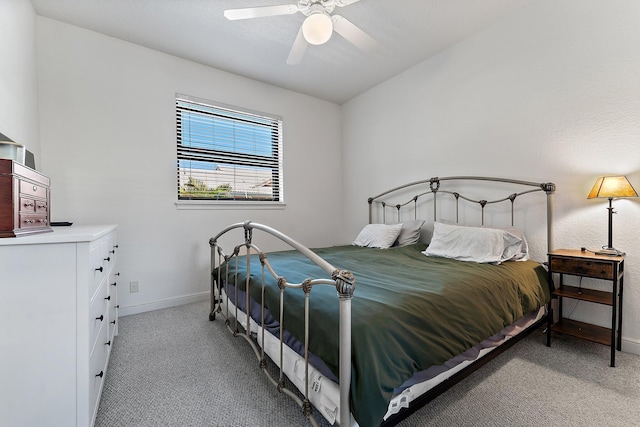 carpeted bedroom featuring ceiling fan and baseboards