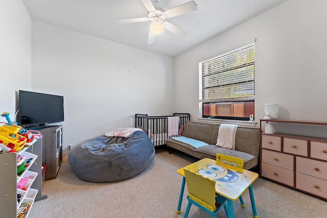 carpeted bedroom featuring a ceiling fan