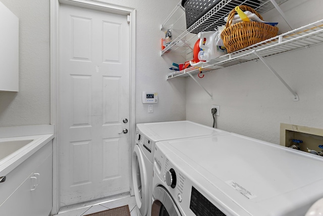 laundry room featuring cabinet space and independent washer and dryer