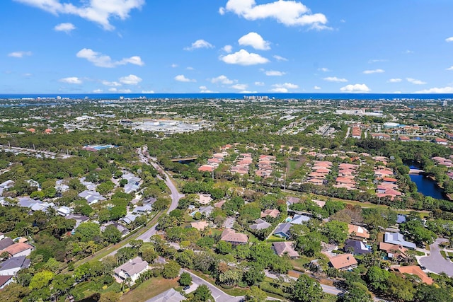 birds eye view of property with a water view and a residential view