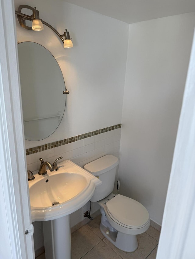 bathroom featuring toilet and tile patterned floors