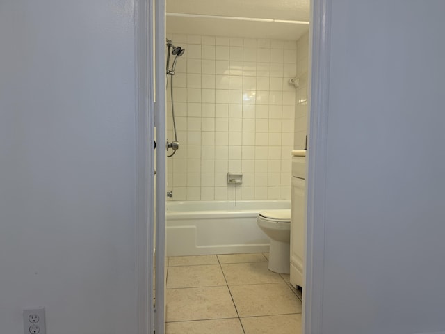 full bathroom with toilet, tile patterned floors, and shower / washtub combination