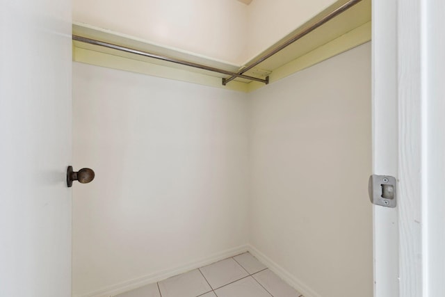 walk in closet featuring light tile patterned floors