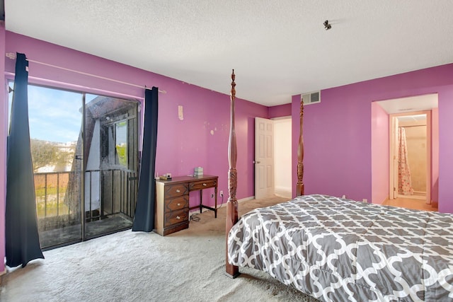 carpeted bedroom with access to exterior, visible vents, and a textured ceiling