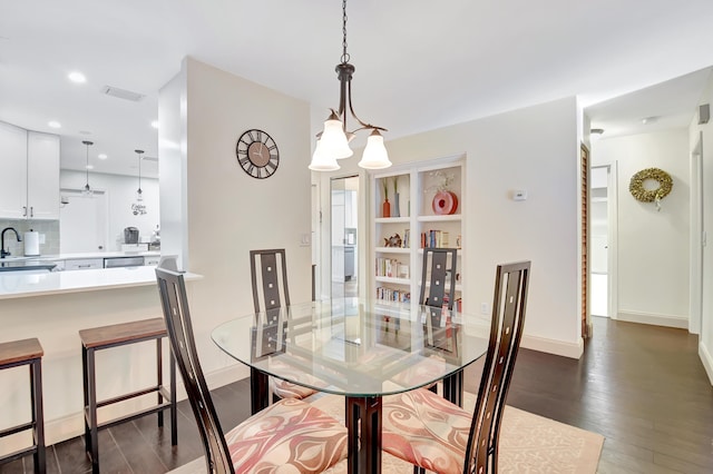 dining space with dark wood-style floors, recessed lighting, visible vents, and baseboards