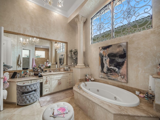 full bath with crown molding, vanity, a whirlpool tub, and decorative columns