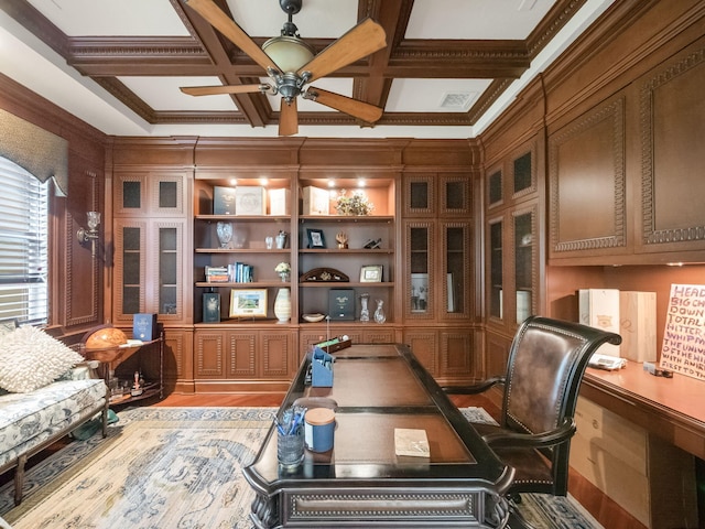 office space featuring visible vents, coffered ceiling, ceiling fan, and light wood-style flooring