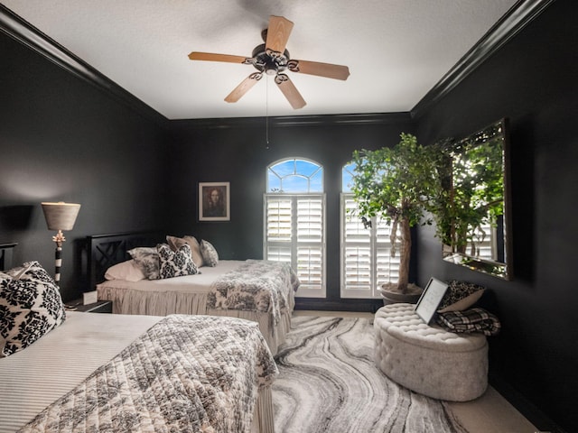 bedroom with ceiling fan and ornamental molding