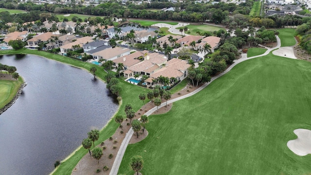 drone / aerial view featuring a water view and a residential view