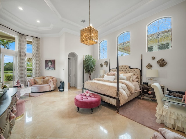 bedroom featuring visible vents, arched walkways, a raised ceiling, a towering ceiling, and ornamental molding