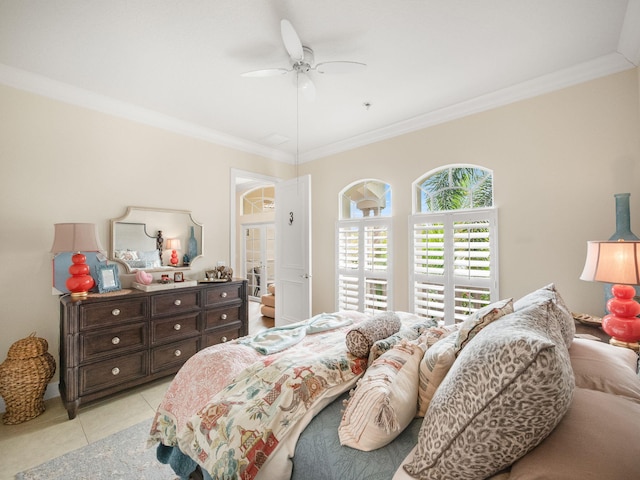 bedroom featuring light tile patterned floors, ornamental molding, and a ceiling fan