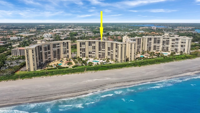 birds eye view of property with a view of the beach, a water view, and a view of city