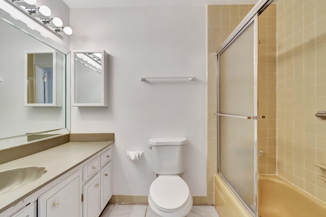 233 Down E Ln, Lake Worth, FL 33467 - full bath with vanity, enclosed tub / shower combo, toilet, tile patterned floors, and baseboards