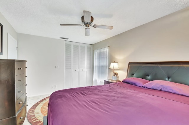 233 Down E Ln, Lake Worth, FL 33467 - bedroom with tile patterned flooring, ceiling fan, and a closet