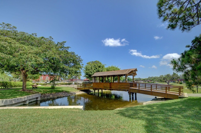 233 Down E Ln, Lake Worth, FL 33467 - dock area with a yard and a water view