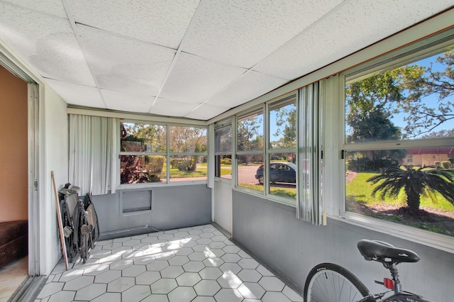 sunroom with a paneled ceiling