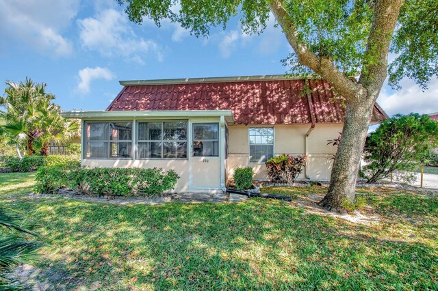 233 Down E Ln, Lake Worth, FL 33467 - view of front of house with a front lawn and stucco siding